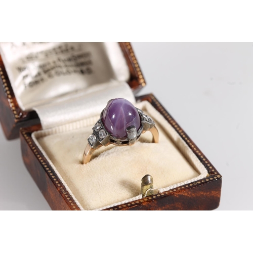 530 - Early 20thC star ruby and diamond ring, the cabochon Burmese or Ceylon ruby flanked by six round cut... 