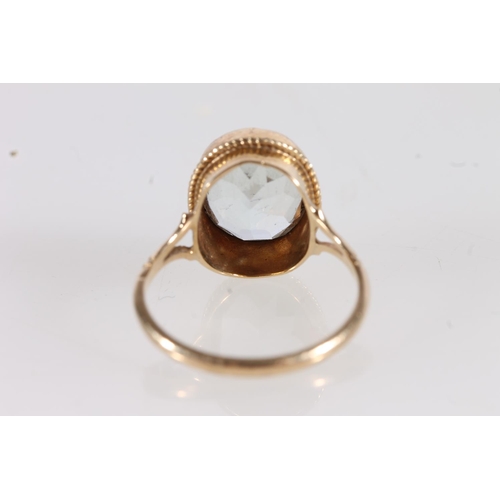 531 - 9ct gold ring set with oval aquamarine coloured stone, size O, 2.8g. 