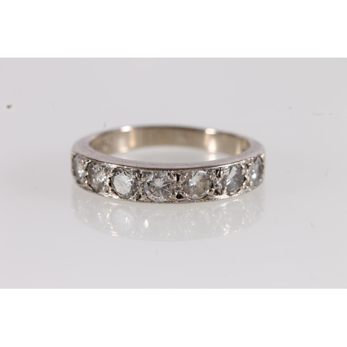 533 - 18ct white gold and diamond half eternity ring, size L/M, the diamonds total approx. 0.5 to 0.6ct.