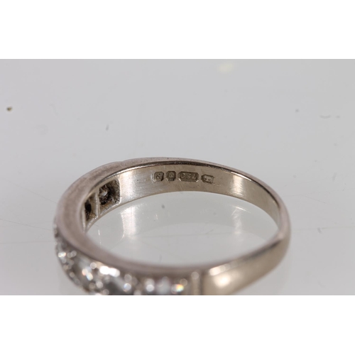 533 - 18ct white gold and diamond half eternity ring, size L/M, the diamonds total approx. 0.5 to 0.6ct.