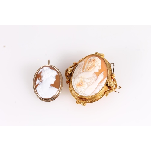 538 - Victorian shell cameo brooch in scrolled yellow metal frame together with a later 20thC shell cameo ... 