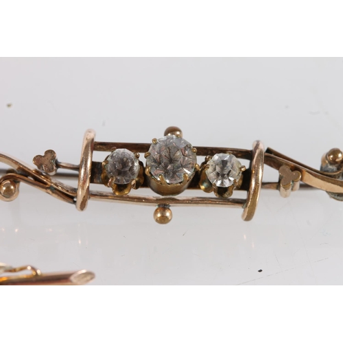 543 - Edwardian 9ct gold bar brooch set with seed pearls and pink stone, 2.3g, together with two base meta... 