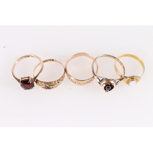 544 - Four 9ct gold rings, 9.2g, together with an unmarked yellow metal and opal ring (5)