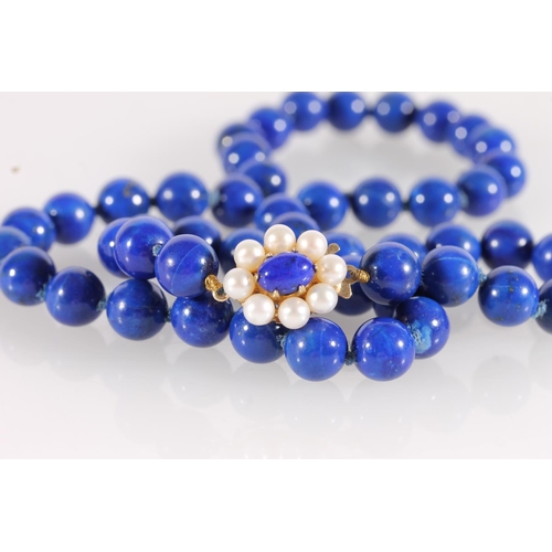 545 - Lapis Lazuli bead necklace with small pearl and 9ct gold clasp, total L46cm.