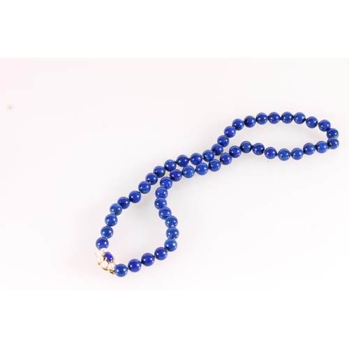 545 - Lapis Lazuli bead necklace with small pearl and 9ct gold clasp, total L46cm.