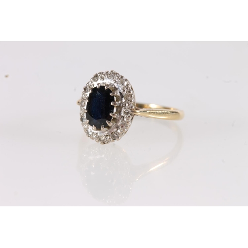 546 - 18ct gold onyx and diamond cluster ring, size O, 4.1g.