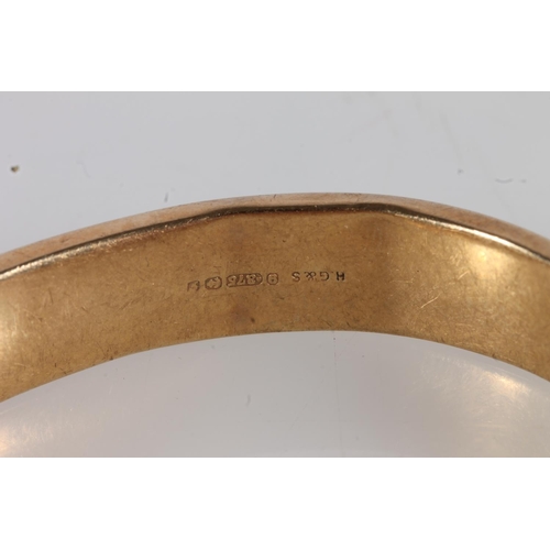 550 - Early 20thC 9ct gold half engraved bangle, internal W5.7cm, 15.1g.