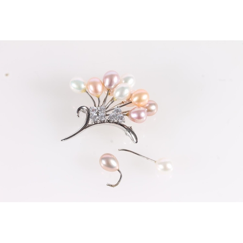 561 - Silver, white stone and pearl spray brooch.