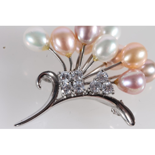 561 - Silver, white stone and pearl spray brooch.