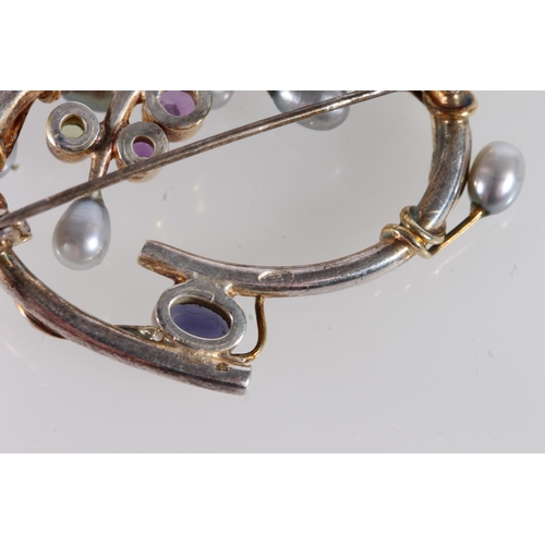 562 - Silver and grey pearl brooch set with amethyst and peridot