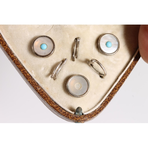 565 - Three Edwardian mother of pearl and turquoise button studs in original case.