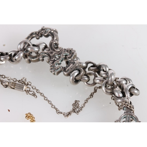 566 - White metal bracelet with gothic pendant, silver and yellow stone brooch, two base metal chains