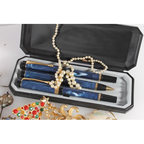 572 - Box of costume jewellery together with a marbled pen set