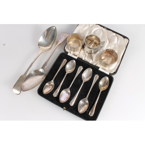 586 - Pair of Georgian silver tablespoons, six silver teaspoon set and three silver napkin rings, gross 30... 