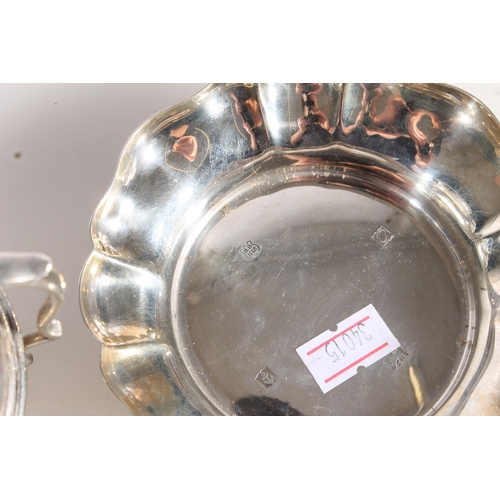 587 - Hallmarked silver small finger bowl and a silver two handled vase, gross 192g.