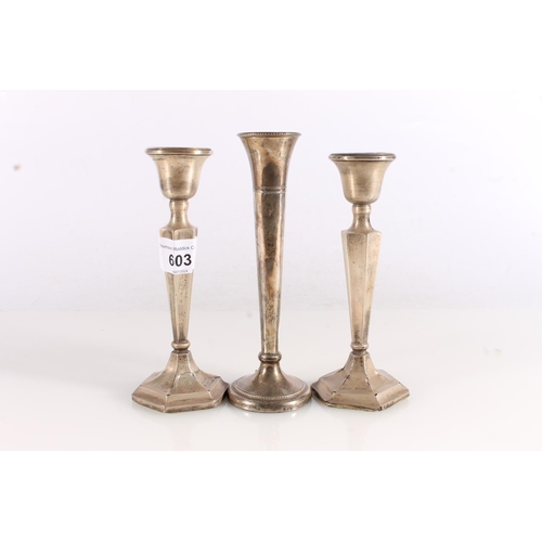 603 - Pair of hallmarked weighted silver candlesticks together with a hallmarked silver solifleur vase, ma... 