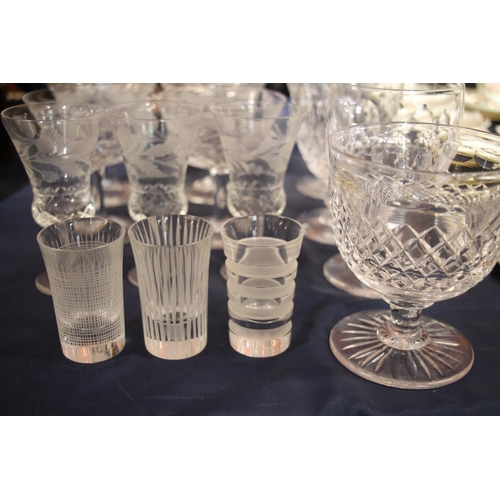 19 - Glassware to include thistle engraved glasses, two Waterford Crystal goblets, and Scandinavian aperi... 