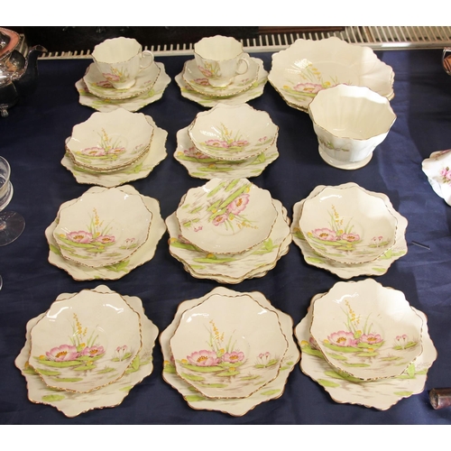 20 - Paragon part teaset comprising, cups, saucers, plates, cake plates decorated with water lilies.