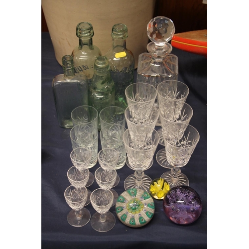 30 - Glassware to include lemonade bottles, a millefiori paperweight, drinking glasses, etc.