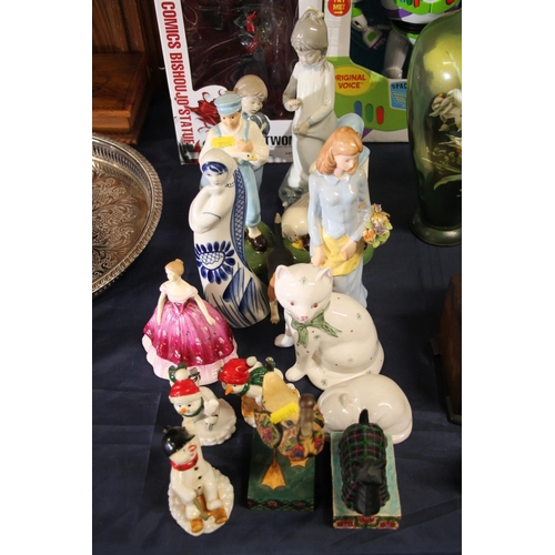 38 - Ceramic and wooden figurines to include Nao, Coalport, etc.