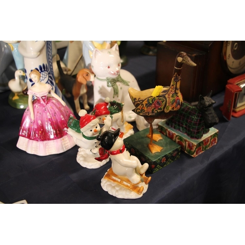 38 - Ceramic and wooden figurines to include Nao, Coalport, etc.