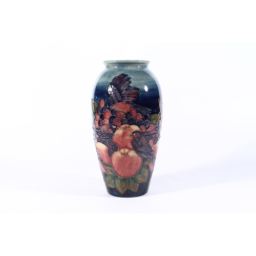 4 - Moorcroft Fruit and Finches vase, 25cm high.