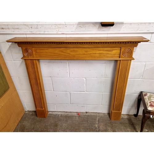 612 - Modern oak fire surround with reeded supports.