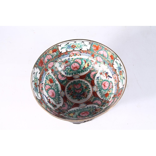 117 - 20th century Chinese famille rose porcelain bowl on hardwood base, 26cm wide.