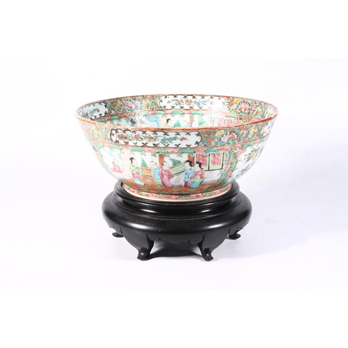 118 - 20th century Chinese famille rose porcelain bowl on hardwood base, 28cm wide.