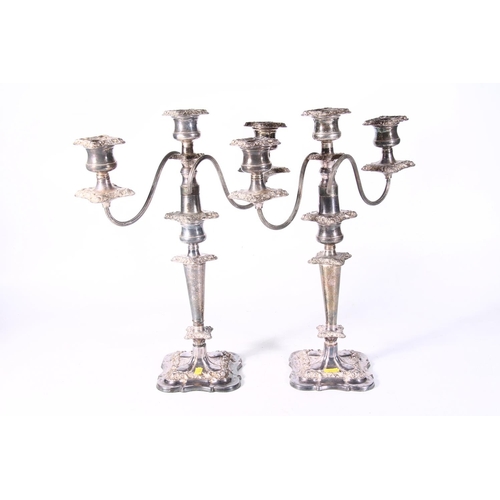 125 - Pair of silver-plated three branch candlesticks.