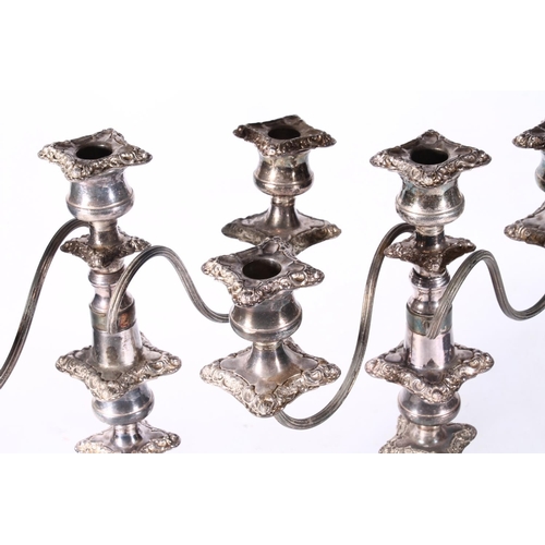 125 - Pair of silver-plated three branch candlesticks.