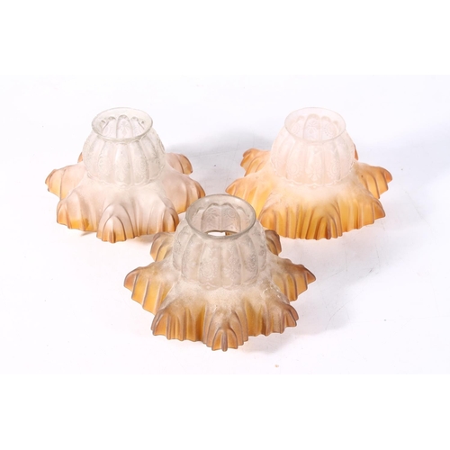 127 - Three 1930s moulded glass lamp shades.