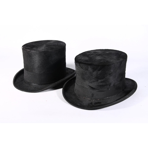 129 - Pair of top hats.