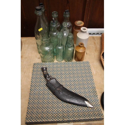 157 - Small kukri, vintage glass bottles and an Alessi tray.