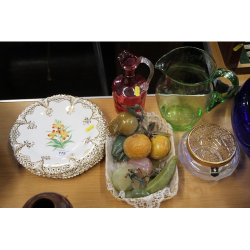 178 - Early 20th century continental floral decorated plates, hardstone fruits, a cranberry glass jug, a g... 