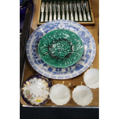 186 - Two green majolica floral plates, a blue and white bowl and five Victorian cups and saucers.