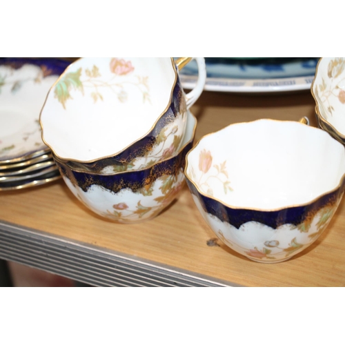 186 - Two green majolica floral plates, a blue and white bowl and five Victorian cups and saucers.