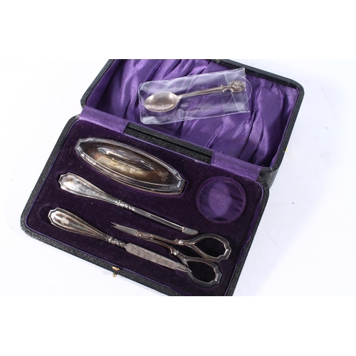 234 - Silver manicure set and a hallmarked silver spoon.