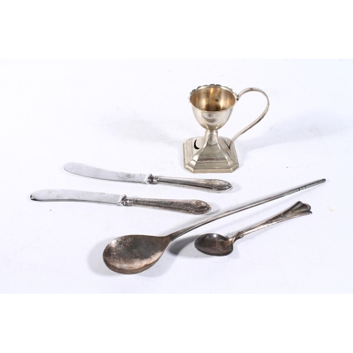 245 - Silver to include an Arts & Crafts style planished spoon and silver-plated egg cup.