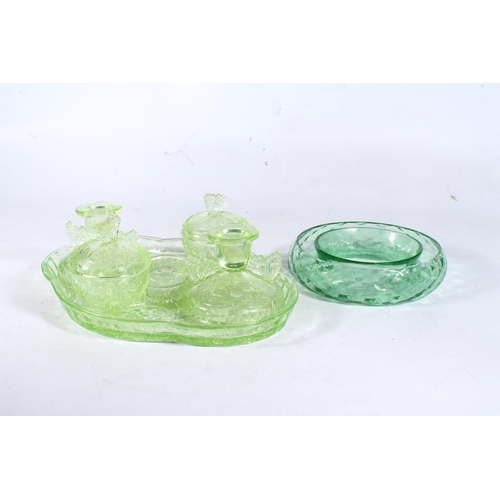 260 - Czechoslovakian green glass pressed dressing table set, and a green glass flower vase.