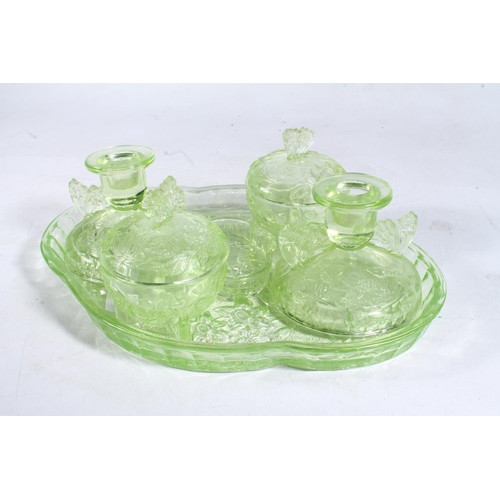 260 - Czechoslovakian green glass pressed dressing table set, and a green glass flower vase.