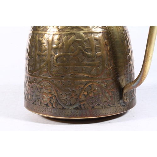 263 - North African/Middle Eastern brass jug, 17cm high.