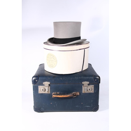 95 - Grey top hat in original box, and a small vintage suitcase.