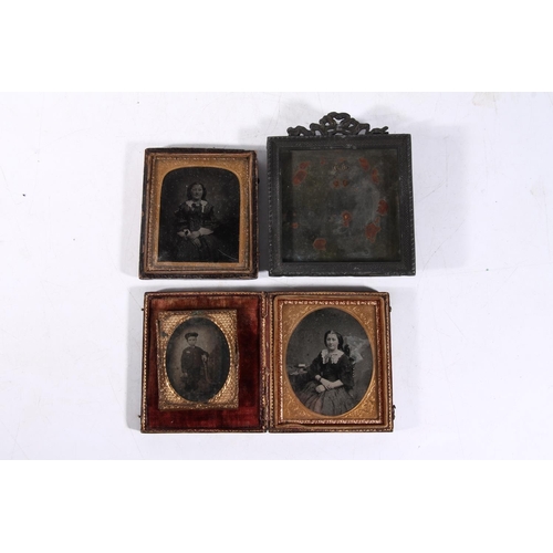 99 - Three ambrotypes and a metal photograph frame.