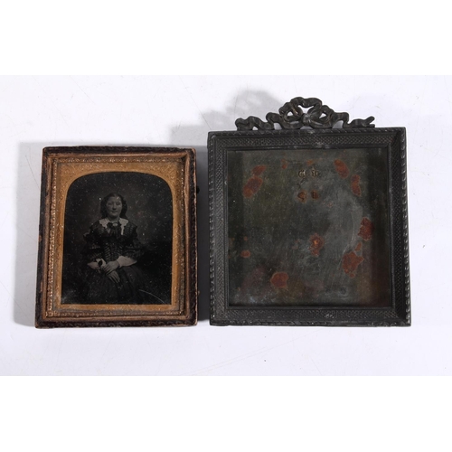 99 - Three ambrotypes and a metal photograph frame.