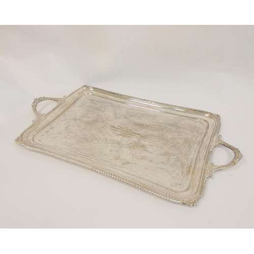 102 - Silver tray, rectangular with slightly incurved sides and gadroon and scroll edges by Hamilton &... 