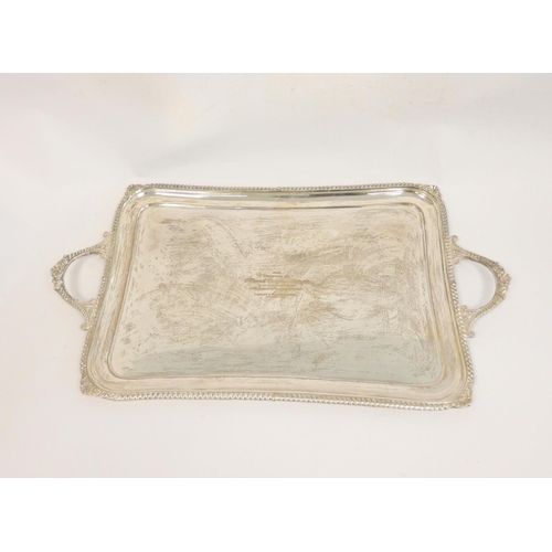 102 - Silver tray, rectangular with slightly incurved sides and gadroon and scroll edges by Hamilton &... 