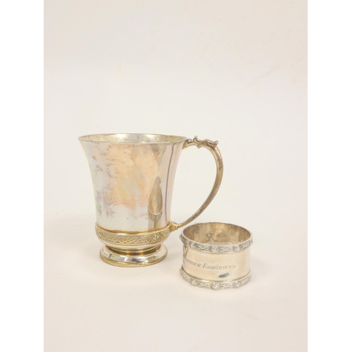 111 - Silver mug and napkin ring with celtic bands, 1953, cased 184g