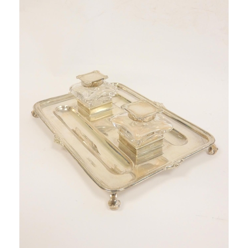 99 - Silver inkstand, rectangular with moulded and scroll edges, two mounted glass receivers (one cap det... 