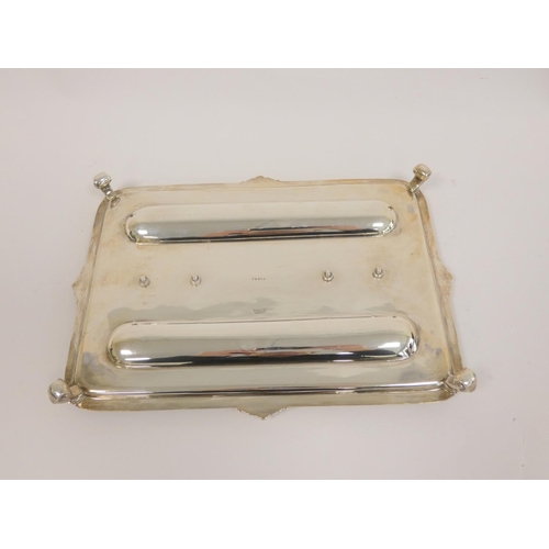 99 - Silver inkstand, rectangular with moulded and scroll edges, two mounted glass receivers (one cap det... 